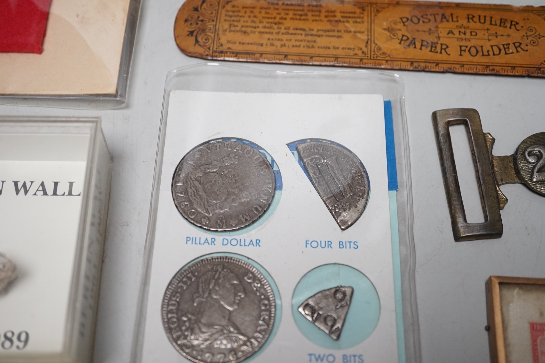 A collection of collectibles: a mother of pearl carves fish, a Mauchlin postal ruler, an enamel box and trays, coinage and various military badges etc